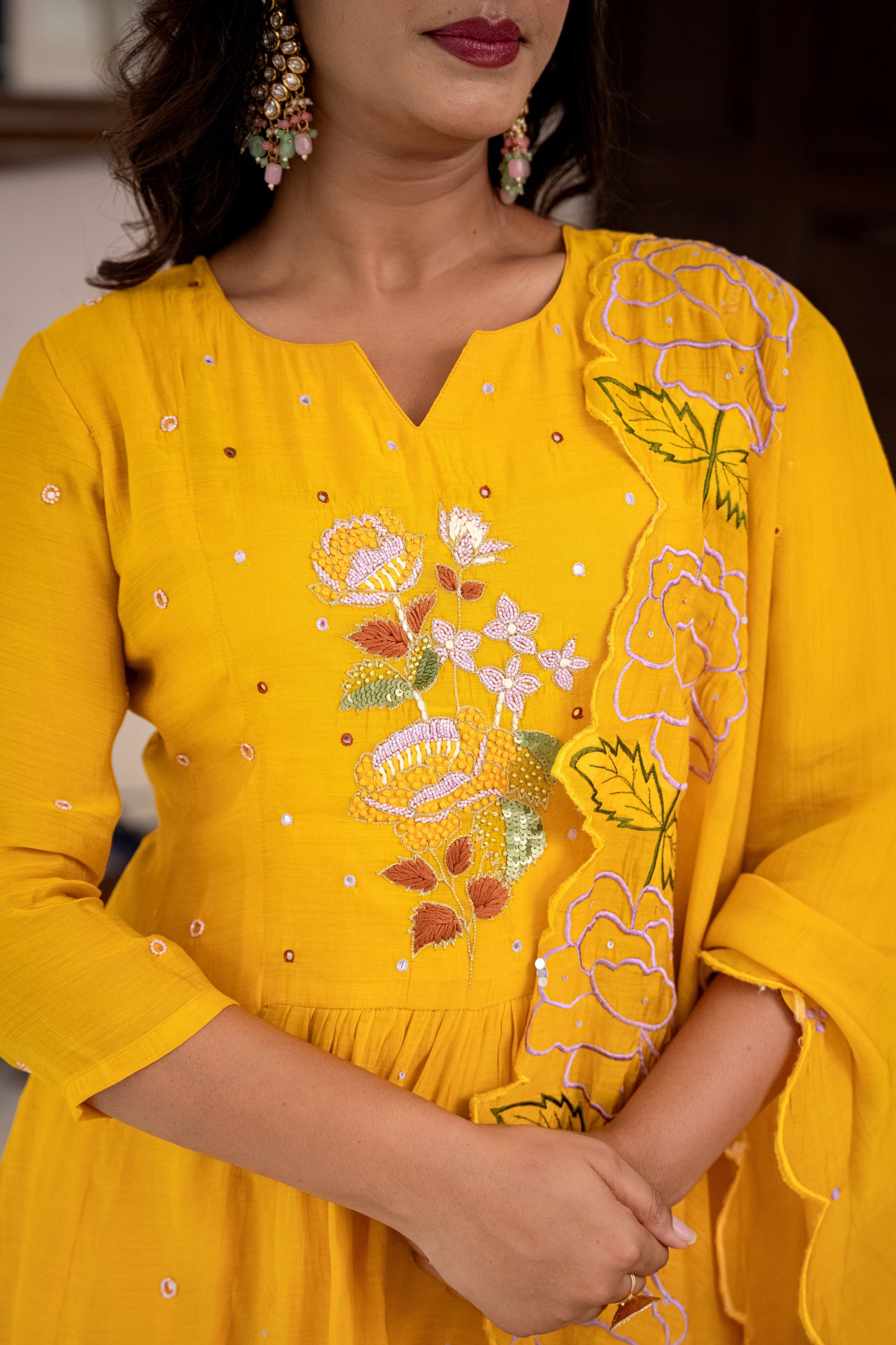 Yellow embroidered dress worn by a person