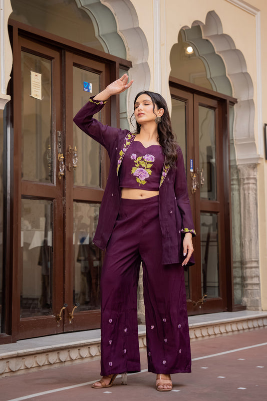 Stylish woman in a purple kurta and palazzo set featuring floral designs, representing graceful festive wear for women