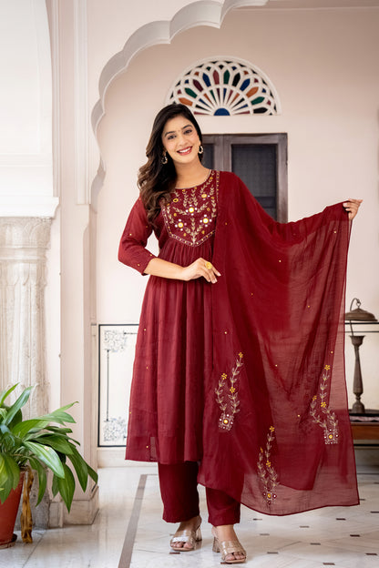 Woman in a red traditional wedding wear kurta set outfit with embroidery 